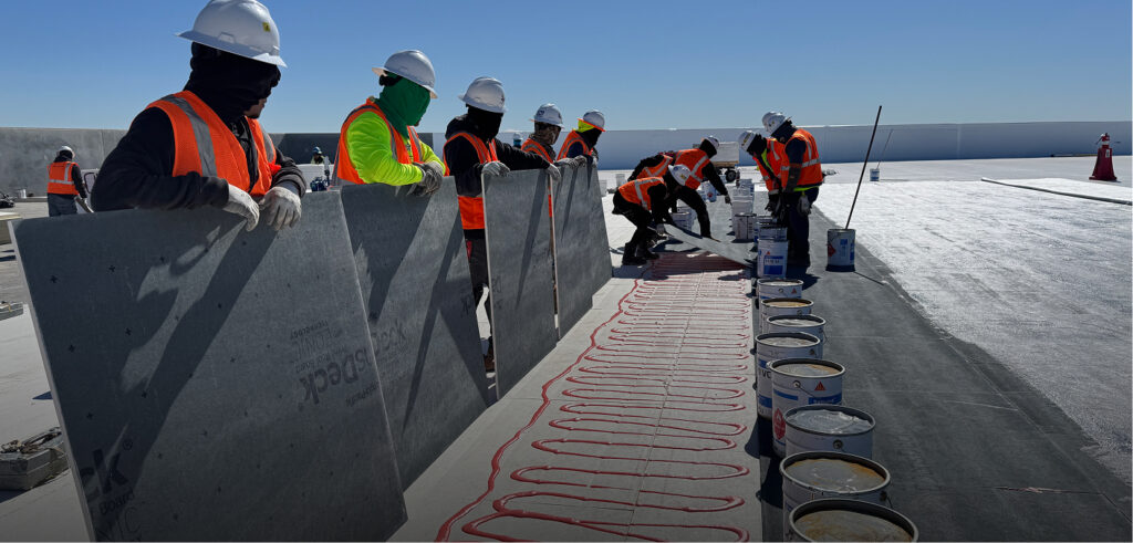 King of Texas commercial roofing contractor installing insulated roofing system on a data center roof