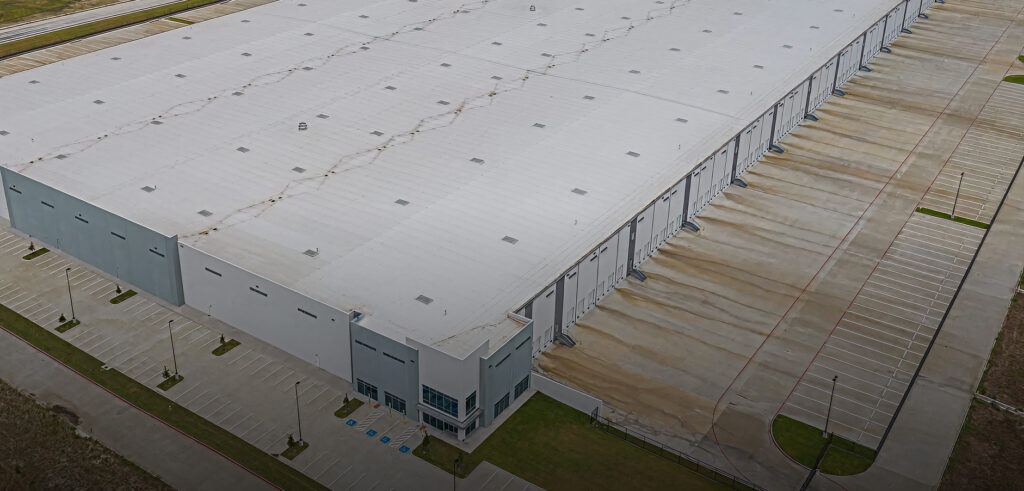 Large distribution warehouse roof installed by King of Texas commercial roofing contractor